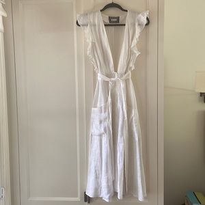 White linen reformation dress. Deep v neck with pockets and waist tie.